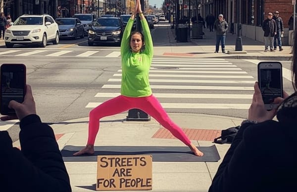 Feminist jogger stops cars by doing yoga in busy crosswalk to protest male spaces